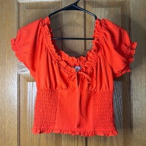 Smocked puff sleeved Urban Outfitters cropped top with ruffle and bow details